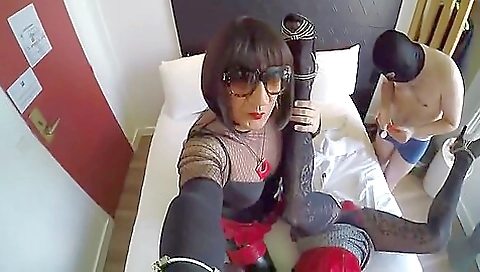 Brunette in stockings fucks two guys in the hotel room